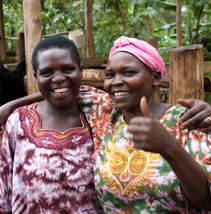 Two women give the thumbs up